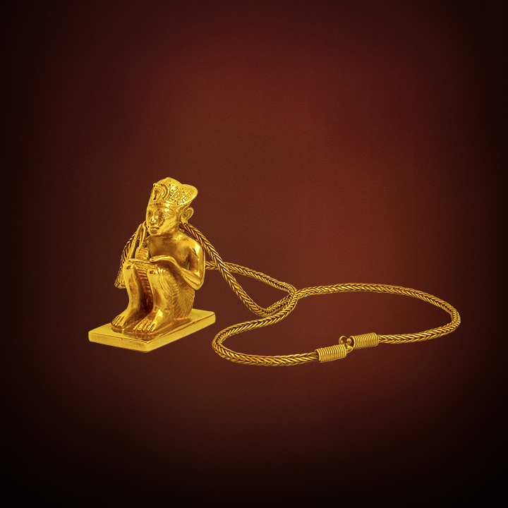 SQUATTING GOLD FIGURE OF THE KING